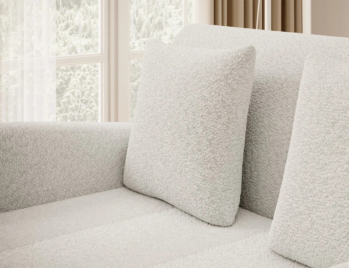 sofa-royal-biala-boucle-detal-poduszki-zblizenie-aranzacja-salon.webp